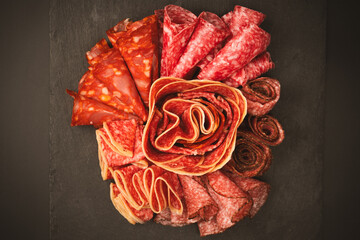 Different kinds of meat cuts on a board.