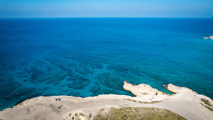 Aerial view of white rocky coastline in Syria. Rocks on coast beautiful sea bay at Latakia beach....