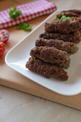 Delicious mititei or rumanian cevapcici on a plate fresh and homemade cooked