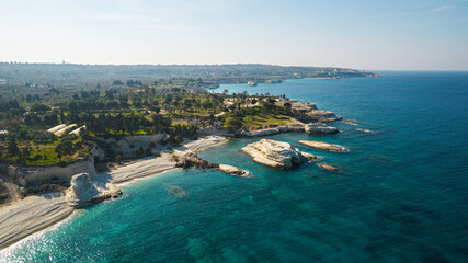 Aerial view of white rocky coastline in Syria. Rocks on coast beautiful sea bay at Latakia beach. Natural landscapes by the sea.
