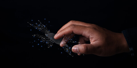 Digital manipulation in technology hand interacting with light particles studio setting close-up...
