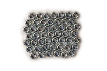 A group of metal nuts isolated on a white background.