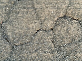 Close up of cracked brown fertile soil with artistic pattern.