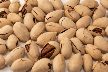 Pecan-nut in a shell isolated on white background. Top view.
