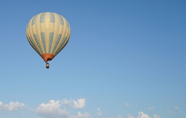 A hot air balloon in the blue sky