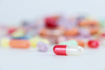 Single red and white medicine capsule. Healthcare concept.