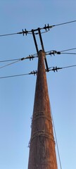 electrical power linesUtility Pole with Electric Wires from Low Angle View

