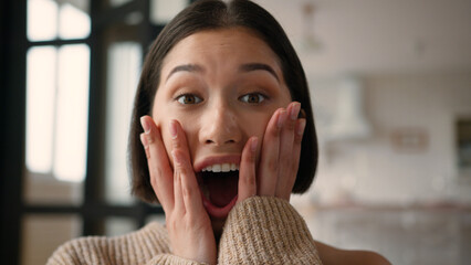 Portrait close up shocked Caucasian hispanic latin woman girl happy reaction shock emotion open...