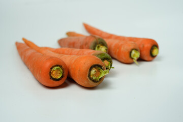 Fresh Whole Carrots on White Background
