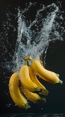 Fresh bananas falling in a splash of water.