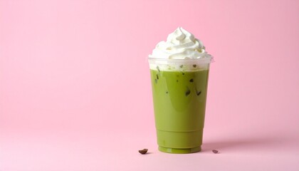 Aesthetic Iced Matcha Coffee Latte in Clear Cup with Pink-Green Milk Layers and Whipped Cream, Set Against a Pastel Pink Background with Soft Shadows and Minimal Styling