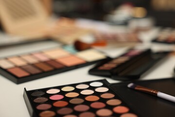 Different makeup products on dressing table, closeup
