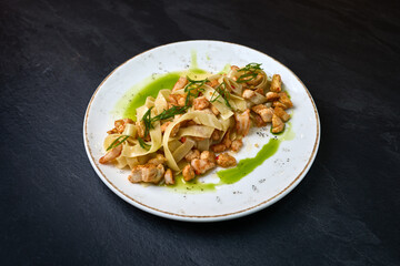 Tagliatelle pasta with chicken and herb sauce