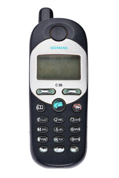 Old Siemens mobile phone model C35 showing retro design in close-up, isolated on white background.