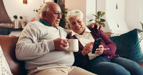 Coffee, phone and elderly couple in home for relax, conversation and laugh together with embrace. Tea, man and woman in retirement with mobile for news, puzzle app or funny meme with joke on internet