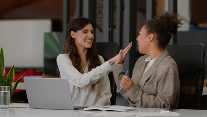 Female winners girls multiethnic Caucasian African American women business partners happy joyful...