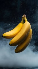 Three bananas suspended in the air, covered in water droplets.