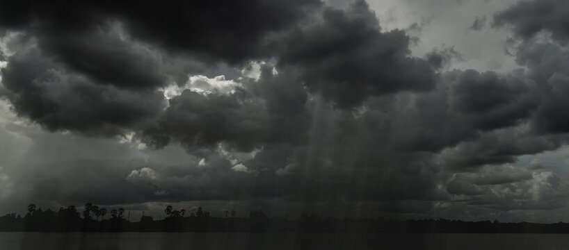 Rain clouds and black sky textured background. Danger storm cloud, Black cloud and thunder storm, Dark sky and motion clouds before rainy