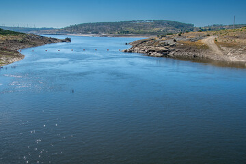 River flowing through dry valley