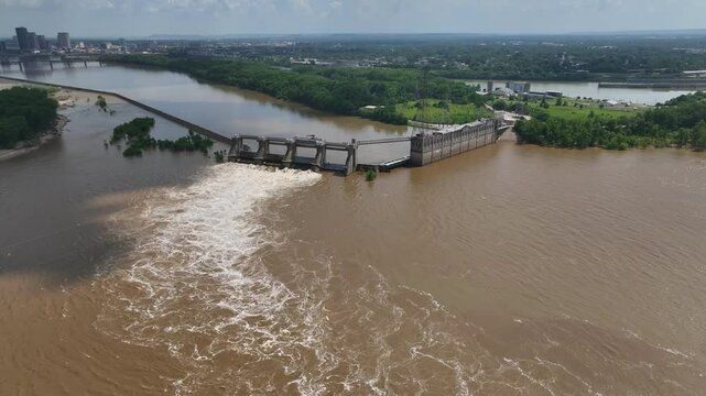 Managing flood waters on Ohio River at Louisville, Kentucky at the Falls of Ohio River at McAlpine Locks and hydroelectric Dam 600 miles below Pittsburg, PA