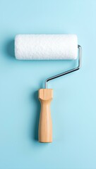 Obraz premium a white paint roller with a wooden handle