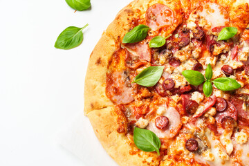 Delicious meat pizza with ham, salami and sausages.