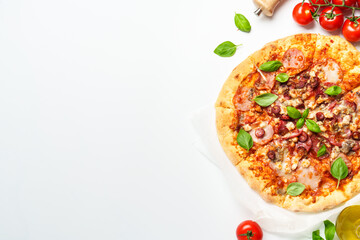 Delicious meat pizza with ham, salami and sausages.