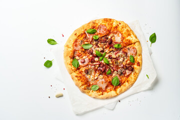 Delicious meat pizza with ham, salami and sausages.