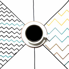 Overhead view of coffee cup on colorful geometric patterned background modern design