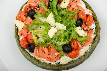 spinach pie with cheese, herbs and tomatoes on a white background macro photo