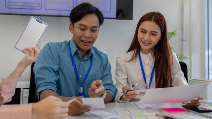 ux, ui, web and mobile app designers are discussing the look and feel of the website or app they...
