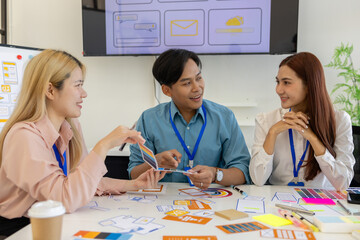 Fototapeta premium ux, ui, mobile app web designers are brainstorming to design a visual display that customers will see and feel comfortable using so color tones and layouts must be carefully selected