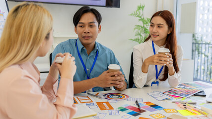 ux, ui, mobile app web designers are brainstorming to design a visual display that customers will...