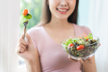 Diet concept, happy smile asian young woman use fork to prick tomato, fresh vegetable or green...