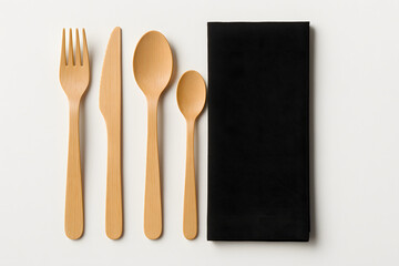 Eco-Friendly Bamboo Cutlery Set with Black Napkin on White Background