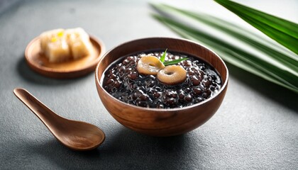 indonesian dessert bubur ketan hitam black glutinous rice porridge served with coconut milk palm sugar and pandan leaf vegetarian dish perfect for breakfast or snack delicious vegan sweet treat