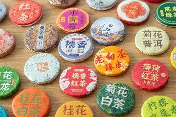 different types of traditional chinese compressed tea for tea ceremony isolated on wooden background