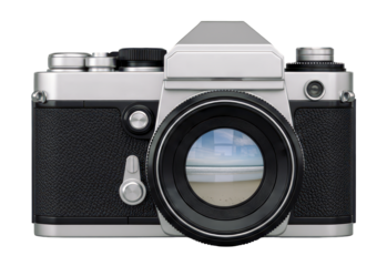 Vintage film camera with a beach reflection in the lens