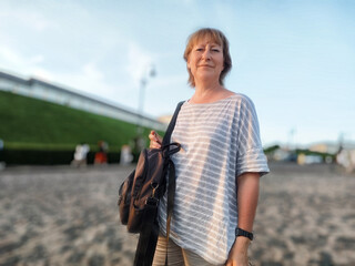 Blonde woman enjoying a lifestyle blogging excursion in Hong Kong on a sunny day while capturing...