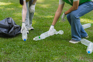 Volunteers Collecting Plastic Bottles in Park