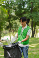 Young Man Cleaning Up Trash in Park