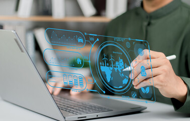 Business man using computer on CO2 emission reduction concept with global warming icon. along with...