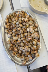 Traditional Portuguese Snail Dish (Caracóis) Served on a Metal Platter