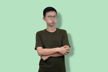 Young Man confident pose Against Solid Pastel Green Background