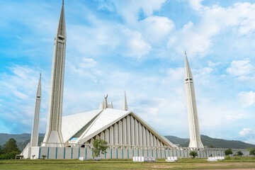The grand Faisal Mosque, Pakistan’s largest, stands majestically in Islamabad beneath the Margalla Hills. A masterpiece of contemporary Islamic design and national pride