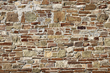 Stone antique old wall as a background or texture. Vintage background of a fortress wall in loft...