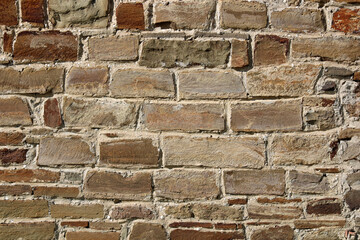 Stone antique old wall as a background or texture. Vintage background of a fortress wall in loft...