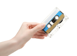 Woman holding audio cassette with blank label on white background, closeup