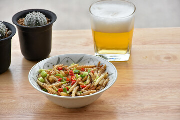  Pupae in bamboo fried crispy insect protein food, appetizer or snack local Thai food, Bamboo Caterpillar is food in street food at northern of thailand.