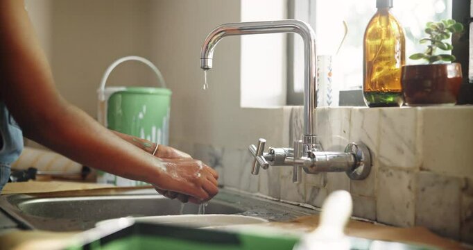 Washing hands, soap and remodeling with woman in kitchen for chemical safety, hygiene and water. Cleaning, painting disinfection and renovation with person and sink in home for diy project and dirt